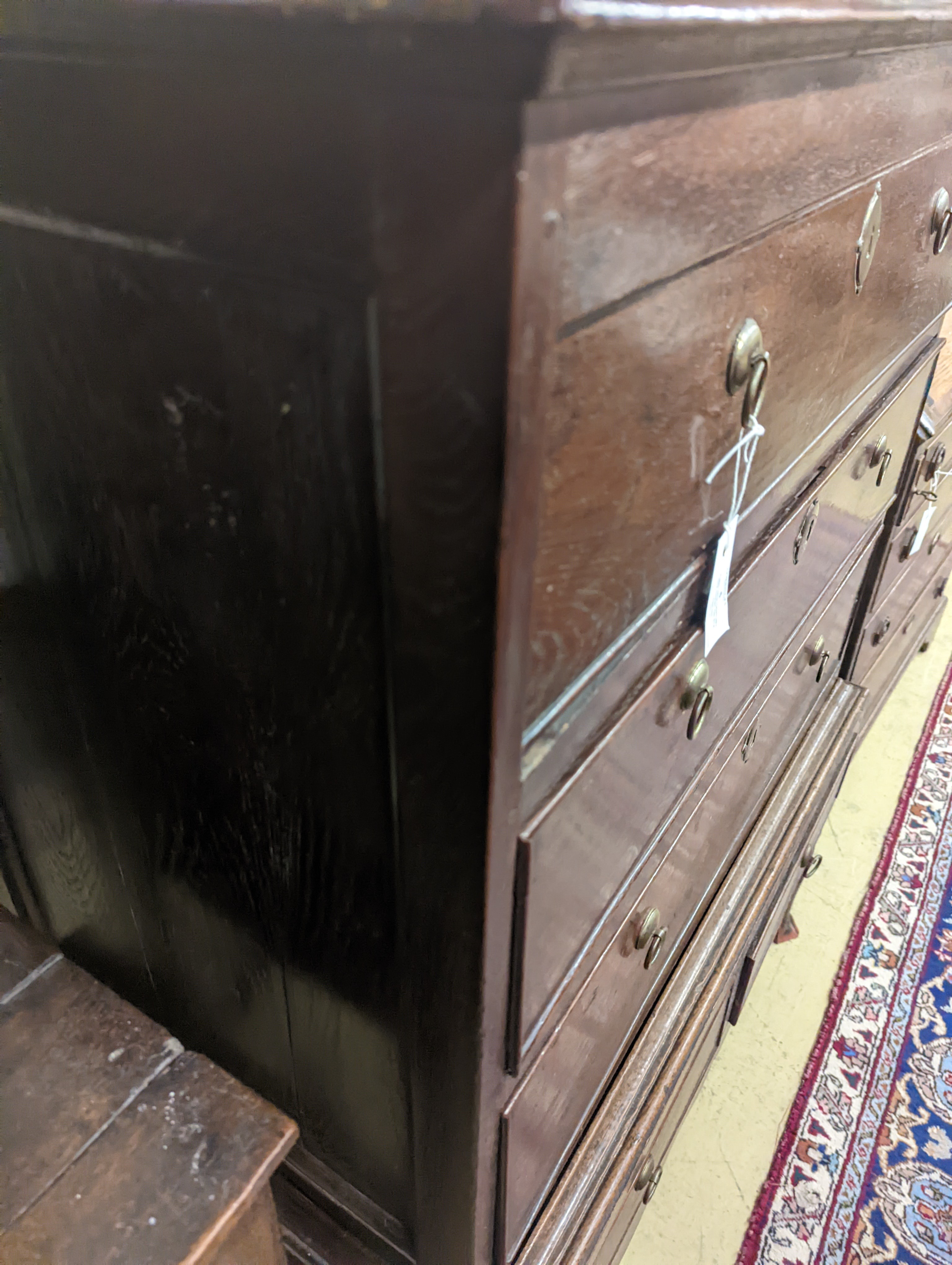 A mid 18th century oak chest on stand, width 89cm, depth 52cm, height 126cm